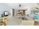 Bright and airy living room with a comfortable sofa and a view of the lanai at 6650 Schooner Bay Cir # 6650, Sarasota, FL 34231