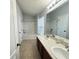 Bright bathroom with dual sinks and a shower-tub combination at 6768 Breezy Palm Dr, Riverview, FL 33578