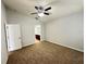 Cozy bedroom with a ceiling fan, neutral paint, and plush carpet at 6768 Breezy Palm Dr, Riverview, FL 33578