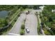 Elegant gated community entrance with lush landscaping, palm trees, and tranquil lakeside views at 6768 Breezy Palm Dr, Riverview, FL 33578