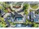 An aerial view reveals a home with a private pool, lush landscaping, and a neatly paved driveway at 7912 Desoto Memorial Hwy, Bradenton, FL 34209