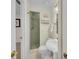 Cozy bathroom featuring a pedestal sink, decorative mirror and a walk-in shower at 7912 Desoto Memorial Hwy, Bradenton, FL 34209