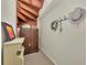 Cozy hallway with a unique spiral staircase and decorative wall hangings at 7912 Desoto Memorial Hwy, Bradenton, FL 34209