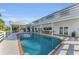 Exterior image of a home showcasing a large pool and white exterior with a spacious outdoor area at 7912 Desoto Memorial Hwy, Bradenton, FL 34209
