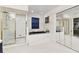 Bathroom showcasing a shower, bathtub, and sliding mirrored closet doors at 9142 16Th Avenue Nw Cir, Bradenton, FL 34209