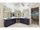 Bright bathroom featuring a large mirror with vanity, drawers, and a stool at 9142 16Th Avenue Nw Cir, Bradenton, FL 34209