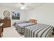 Bedroom featuring three beds, a dresser and a mirror at 9142 16Th Avenue Nw Cir, Bradenton, FL 34209