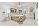 Bright bedroom featuring a large bed, nightstands, and plenty of storage at 9142 16Th Avenue Nw Cir, Bradenton, FL 34209