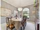 Elegant dining room featuring a chandelier, large window, and classic decor at 9142 16Th Avenue Nw Cir, Bradenton, FL 34209