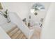 Bright two story entryway features stairs leading up to a chandelier and arched window at 9142 16Th Avenue Nw Cir, Bradenton, FL 34209