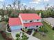 Aerial view of home with well-maintained lawn, manicured landscaping, and a red roof at 9142 16Th Avenue Nw Cir, Bradenton, FL 34209