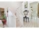 Bright foyer with white staircase and tiled floors at 9142 16Th Avenue Nw Cir, Bradenton, FL 34209