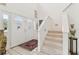 Welcoming foyer featuring a tiled floor, staircase, and a decorative double-door entrance at 9142 16Th Avenue Nw Cir, Bradenton, FL 34209