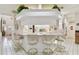 Open-concept kitchen bar with seating area and white cabinets perfect for gatherings at 9142 16Th Avenue Nw Cir, Bradenton, FL 34209