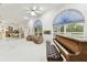 Spacious living room showcases grand windows, a piano, and comfortable seating at 9142 16Th Avenue Nw Cir, Bradenton, FL 34209
