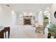 Spacious living room featuring a tiled fireplace, arched windows, and neutral decor at 9142 16Th Avenue Nw Cir, Bradenton, FL 34209