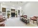 Bright living room with large windows, built-in shelving, and comfortable seating at 9142 16Th Avenue Nw Cir, Bradenton, FL 34209