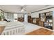 This carpeted main bedroom features wood furnishings and shelving in a bright setting at 9142 16Th Avenue Nw Cir, Bradenton, FL 34209