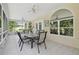 Inviting patio with ceiling fans, tile flooring and serene outdoor views at 9142 16Th Avenue Nw Cir, Bradenton, FL 34209