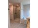 Bright bathroom with a glass enclosed shower and a garden tub at 2556 Averland Loop, North Port, FL 34287
