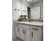 Bathroom vanity features granite countertops, white cabinets and modern black hardware at 2556 Averland Loop, North Port, FL 34287