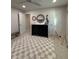 Bright Bedroom showcases a black dresser with round mirror and a light gray and cream checkered rug at 2556 Averland Loop, North Port, FL 34287