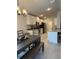 View of kitchen and dining room area featuring stainless steel appliances and granite countertops at 2556 Averland Loop, North Port, FL 34287