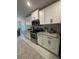 Bright kitchen featuring stainless steel appliances, granite countertops, and decorative backsplash at 2556 Averland Loop, North Port, FL 34287