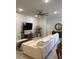 Bright living room featuring a large sectional, ceiling fan, modern decor, and an inviting atmosphere at 2556 Averland Loop, North Port, FL 34287
