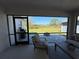 Cozy screened-in patio with comfortable seating and views of the backyard at 2556 Averland Loop, North Port, FL 34287