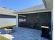 The backyard features a patio, a fire pit, and a grill near the house at 2556 Averland Loop, North Port, FL 34287