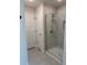 Bathroom featuring a modern glass shower with tiled walls at 2556 Averland Loop, North Port, FL 34287