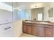 Bathroom with a glass-enclosed shower and double vanity at 11516 Griffith Park Ter, Bradenton, FL 34211