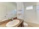 Bathroom featuring a granite countertop, vanity, and tiled shower at 11516 Griffith Park Ter, Bradenton, FL 34211