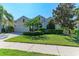 Charming single-story home featuring a well-manicured lawn, mature landscaping, and an attached two-car garage at 11516 Griffith Park Ter, Bradenton, FL 34211