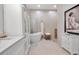 Luxurious bathroom featuring a standalone tub, marble countertops, and elegant modern fixtures at 13303 Swiftwater Way, Lakewood Ranch, FL 34211