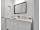 Elegant bathroom featuring double sinks, a stylish mirror, and a neutral color palette for a spa-like ambiance at 13303 Swiftwater Way, Lakewood Ranch, FL 34211