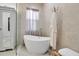 Bright bathroom featuring a standalone tub near a window for a spa-like experience at 13303 Swiftwater Way, Lakewood Ranch, FL 34211