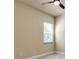 A neutral bedroom with a ceiling fan, light wood floors, baseboard trim, and a window with blinds at 13303 Swiftwater Way, Lakewood Ranch, FL 34211