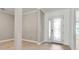 Inviting foyer with light wood floors, elegant front door with decorative glass, and neutral wall colors at 13303 Swiftwater Way, Lakewood Ranch, FL 34211