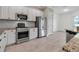 Well-equipped kitchen with stainless steel appliances, white cabinets, and subway tile backsplash at 13303 Swiftwater Way, Lakewood Ranch, FL 34211