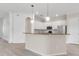 Bright kitchen with granite countertops, white cabinets, and modern pendant lighting at 13303 Swiftwater Way, Lakewood Ranch, FL 34211