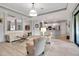 Bright, open-concept living area with neutral tones and an elegant modern decor at 13303 Swiftwater Way, Lakewood Ranch, FL 34211