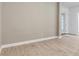 Unfurnished living room featuring light wood floors and neutral walls, showcasing the space's potential at 13303 Swiftwater Way, Lakewood Ranch, FL 34211