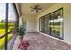 Screened-in patio featuring brick pavers, flower pots, and a beautiful view of the outdoors at 13303 Swiftwater Way, Lakewood Ranch, FL 34211