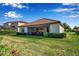 A private backyard featuring a screened lanai and lush landscaping at 13303 Swiftwater Way, Lakewood Ranch, FL 34211