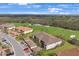Aerial view of the community showcasing lush greenery, golf course, and well-maintained buildings at 13816 Messina Loop # 104, Bradenton, FL 34211