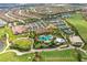 Expansive aerial view of a sprawling community with lakes, golf course, and amenities at 13816 Messina Loop # 104, Bradenton, FL 34211