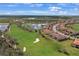 Panoramic aerial view of the community overlooking a golf course, lake, and residential homes at 13816 Messina Loop # 104, Bradenton, FL 34211