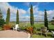Outdoor lounge seating and dining area near the driving range at 13816 Messina Loop # 104, Bradenton, FL 34211
